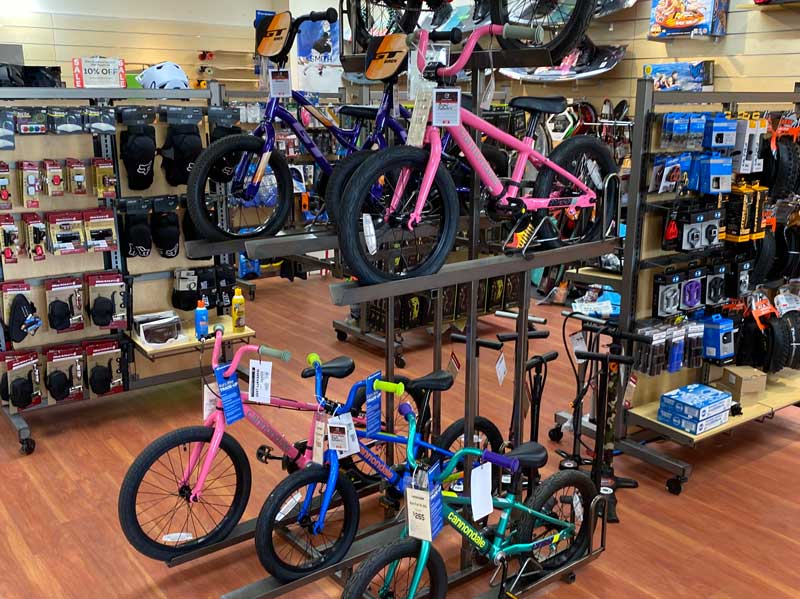 Kids bikes and bike accessories on display at Sun & Ski Sports Park City bike shop